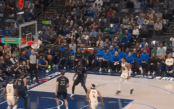 NBA broadcast frame near the basket with the logo tightly boxed by the fine-tuned model.