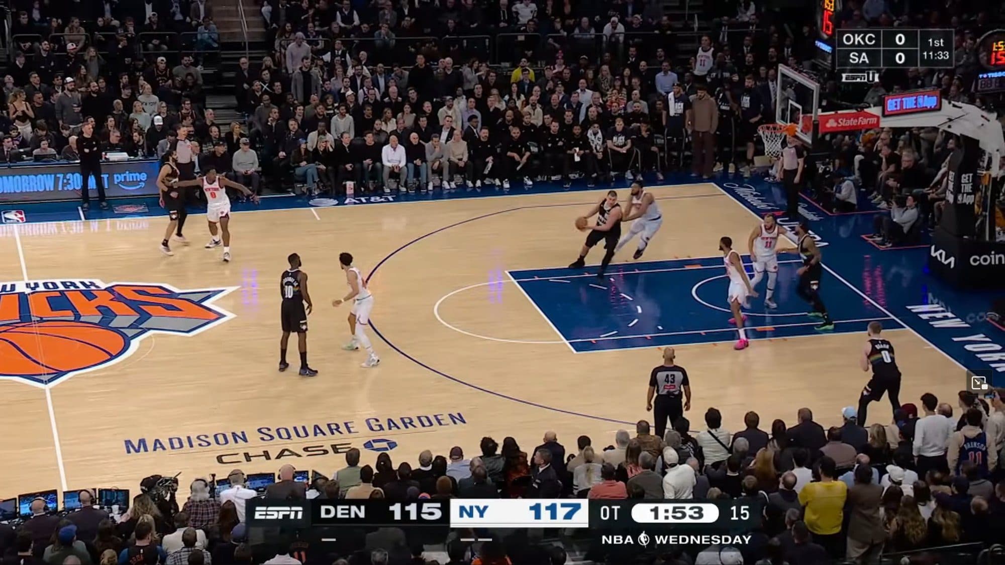 Basketball game with many players on court